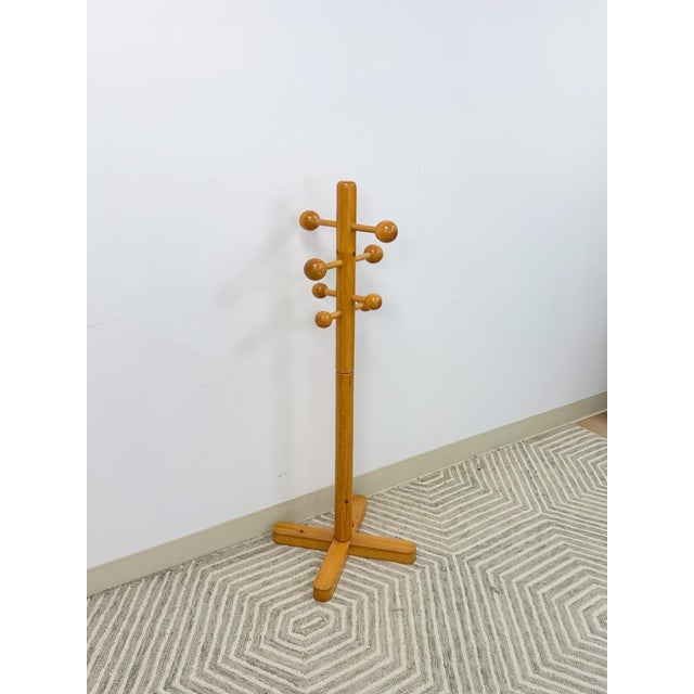 This fun and eye-catching vintage atomic coat and hat rack is a charming mid-century modern entryway piece. The bold...