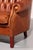 Experience the enduring charm of classic craftsmanship with this exquisite antiqued leather Chesterfield sofa. Carefully...