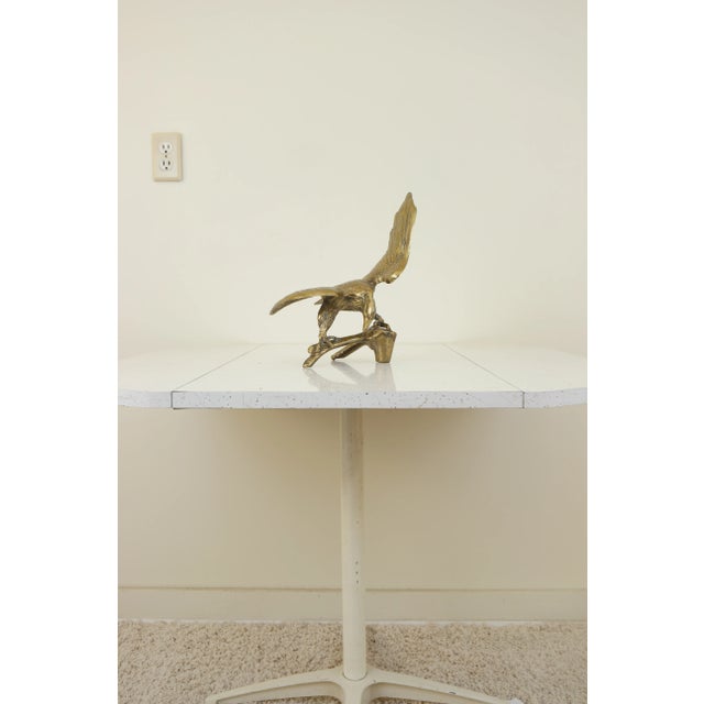 This eye catching vintage bird sculpture is cast in brass, and will add a little natural history flare to any room. The...