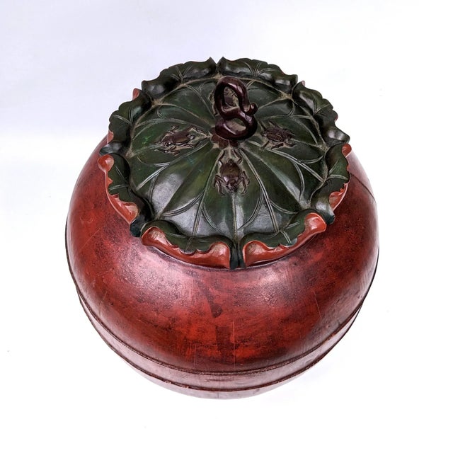 A very unique large vessel with a hand carved lotus leaf lid adorned with insects. Great condition