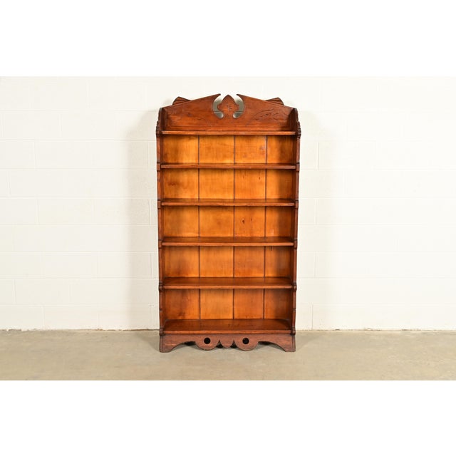 A gorgeous antique Victorian or Arts & Crafts carved oak bookcase USA, Circa 1900 Measures: 37.25"W x 11.75"D x 69"H. Good...