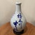 This Antique Japanese Tokkuri (Sake Long Neck Bottle) features intricate blue underglaze calligraphy, showcasing...
