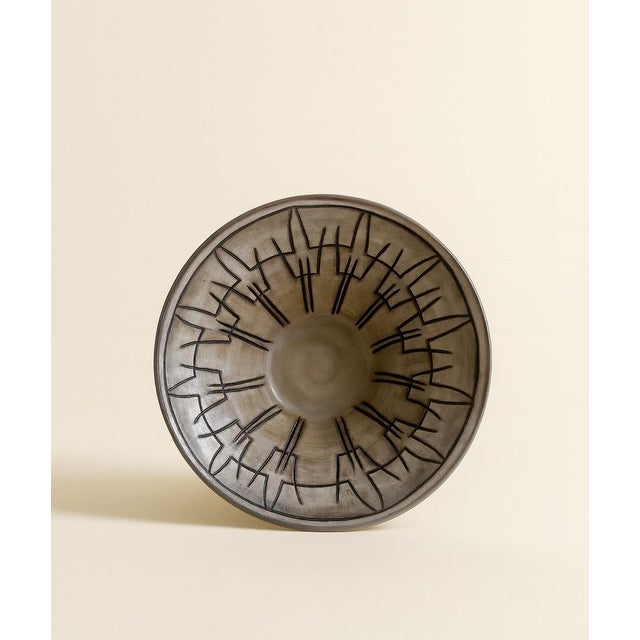 Elegant ceramic bowl by French artist Jacques Pouchain, Dieulefit, circa 1960s. Wheel-thrown stoneware with a gray-brown...