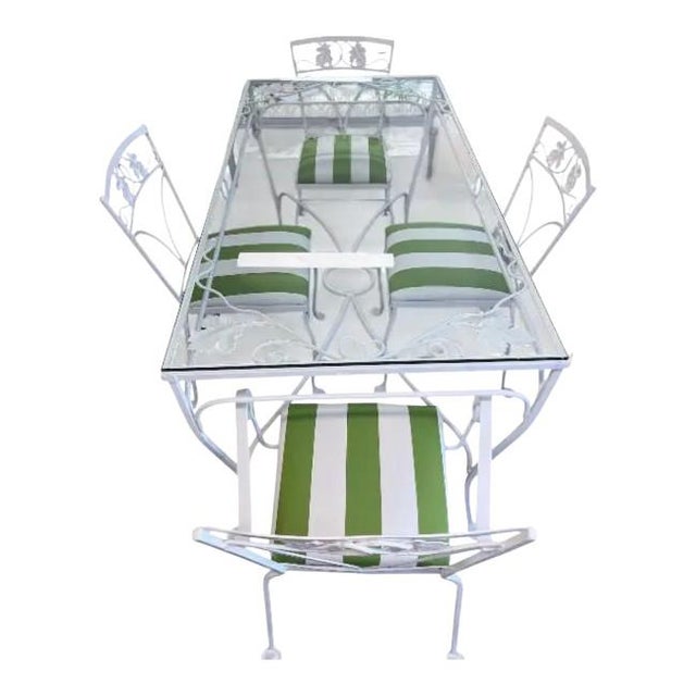A charming vintage wrought iron patio/dining set, freshly painted in Benjamin Moore Mountain Peak White. The set includes:...