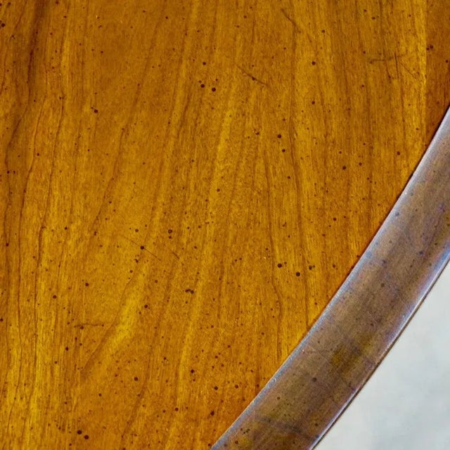 Round mid century game table. Walnut with a glossy finish. Very solid construction. No makers marks. Very good condition...