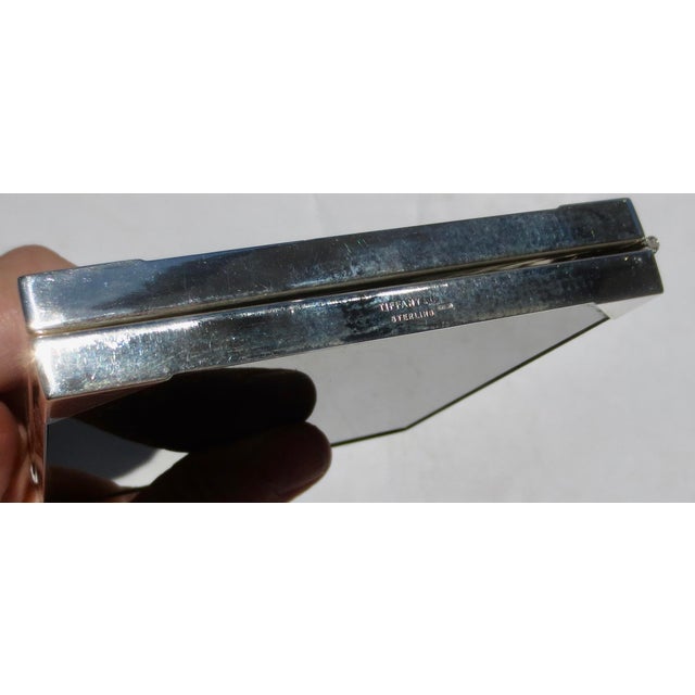 Sterling silver modern frame with two windows. Modern design with black lucite back panels. marked Tiffany & Co. with...