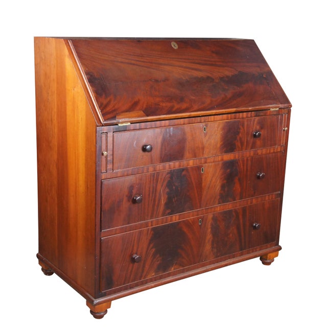 Exquisite antique secretary writing storage desk. Made of flame mahogany featuring Georgian styling with three large...