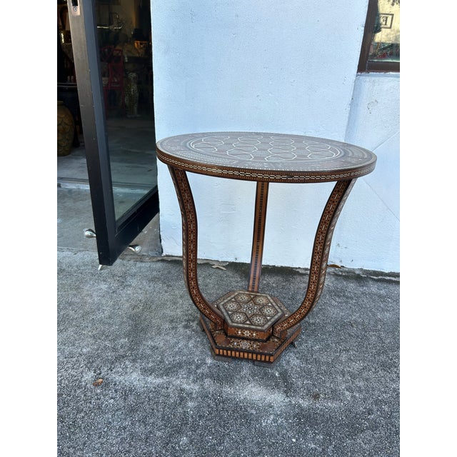 Impressive, antique Moroccan stand featuring inlaid exotic hardwoods, mother of pearl and marquetry in geometric motifs.