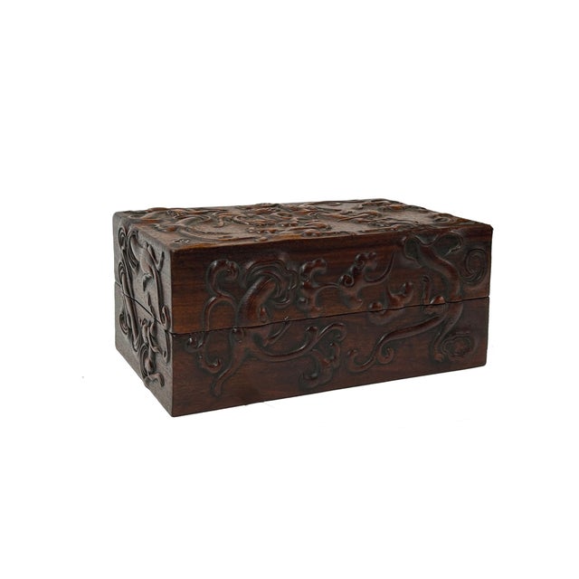 This rectangular wooden box is a striking example of East Asian-inspired craftsmanship, featuring a deep, warm mahogany...