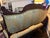 Gorgeous settee in excellent condition. Gold fabric with aqua highlights and a dark wood frame. Settee was refurbished in...