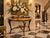 Offering an exquisite demi-lune console table featuring a stunning geometric lacquered pen shell veneer top in rich amber...