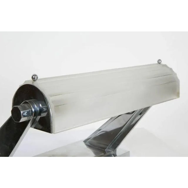 An Art Déco desk lamp by Sabino from the 1930s. Chromium plated metal and glass. Signed "Sabino Paris Made in France"....