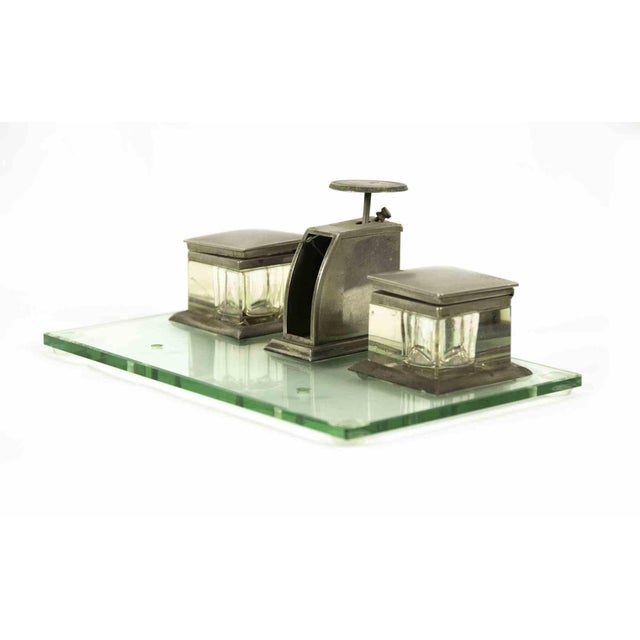 Vintage inkwell is a decorative object realized in the Mid-20th Century Silver and glass inkwell. Fair conditions due to...