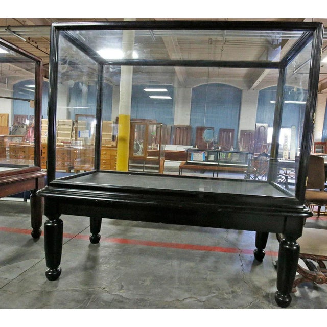 Antique late 19th century English display cabinet on stand. Glass doors open on sides. For showcasing artifacts,...