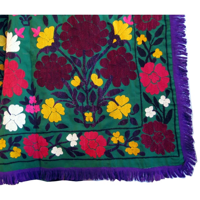 Gorgeous vintage embroidered Suzani bright green wool crepe background with Large and small flowers in vibrant reds,...