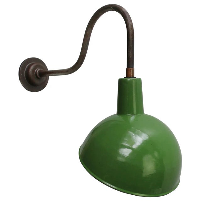 Green enamel industrial wall light with white interior. Diameter cast iron wall mount: 10.5 cm / 4” cm, 2 holes to secure....