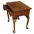 This early 18th-century walnut lowboy features cabriole legs, pad feet, and feather-banded drawers with an elegant arched...
