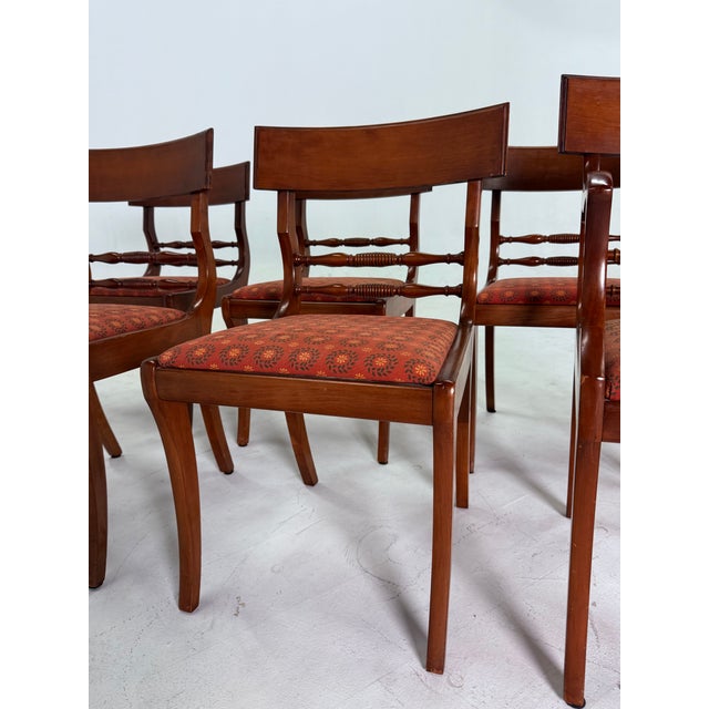 Add timeless elegance to your dining room with this vintage set of solid wood chairs, including one arm chair. Features...
