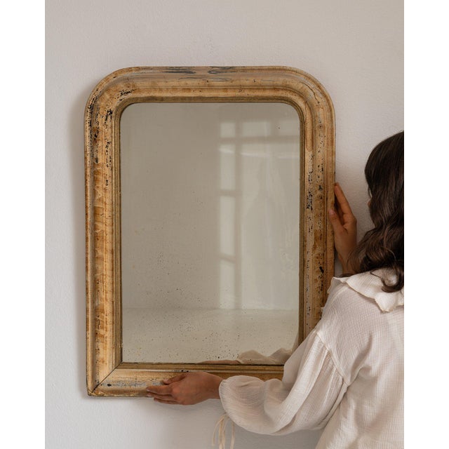 Cerused oak wall mirror in Weathered Whitewash. Its weathered whitewash finish sets off simple molded frame, softly worn...