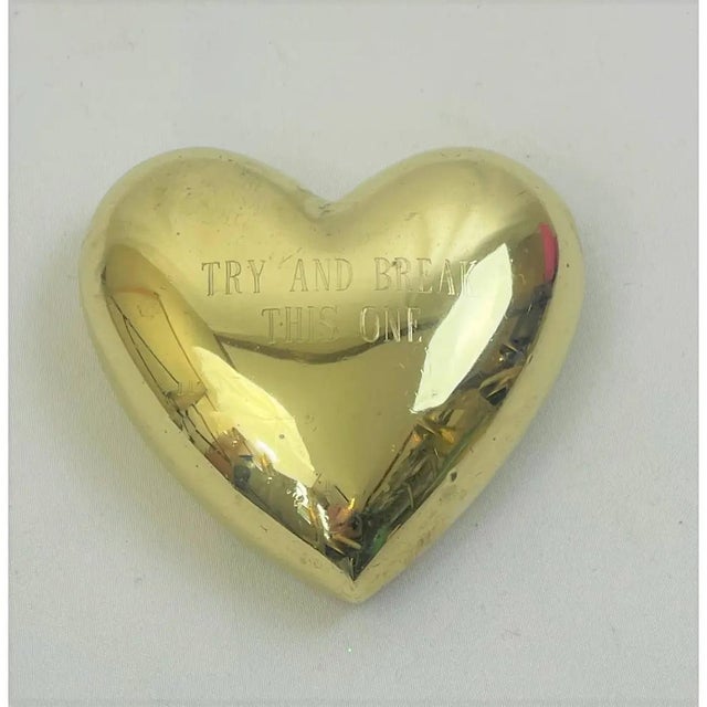 This is a mid-century solid brass heart paperweight with signature Alexander Shields on the back and with inscription on...