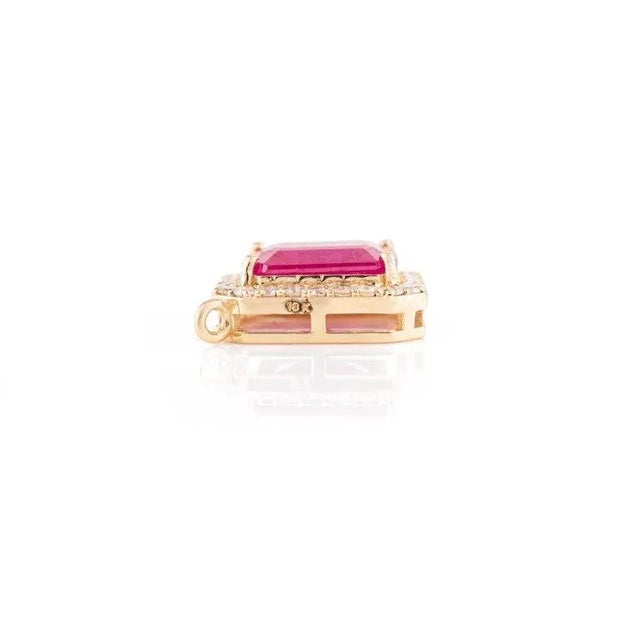 This is part of Chairish’s Fine Jewelry assortment. Octagon Ruby Diamond Halo Pendant in 18K Gold studded with ruby with...