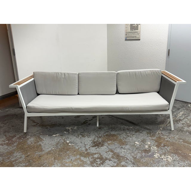 Design Plus Gallery presents the Seville Outdoor Sofa from Modani. The sofa has a white powder-coated metal frame accented...