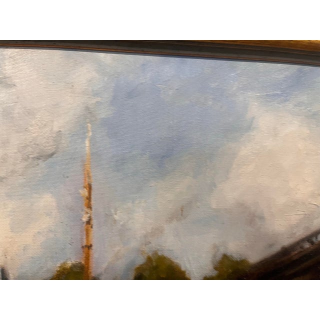 Signature in bottom right, but not clear. . This lovely oil on canvas painting captures a serene riverside or harbor...