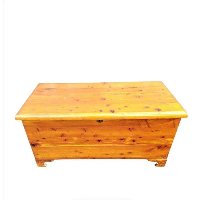 Great old pine chest. Cedar lining. Solid Wood Handles on both sides. Very Well made. Clean inside out. Dims: 36"W x 17" D...