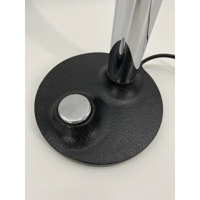 A table lamp *around 1960 * black painted metal shade * Heavy base with large, chrome -colored TAST switch and shrinkpack....