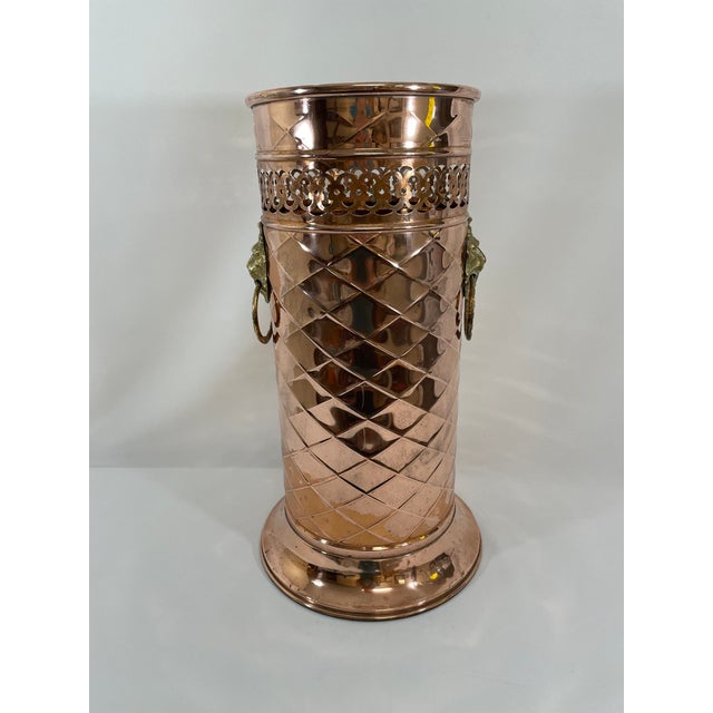 A gorgeous hand crafted Hammered Copper French Umbrella or Stick Stand with ornate brass lion head ring pulls. Circa Mid...