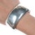 6/5" Vintage Southwestern silver bracelet 34mm wide in center, likely Native American made. All precious metals are...