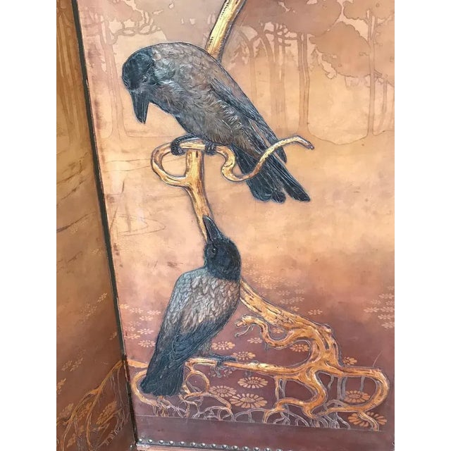 Large Georg Hulbe Art Nouveau tooled three panel screen. Featuring a wood and birds motif. with superbly detailed leather...
