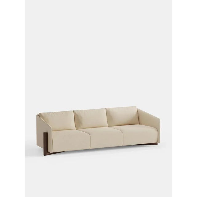 Cream timber 4 seater sofa by kann design dimensions: d 104.5 x w 260 x h 75 cm. Materials: solid wood, elastic belts, hr...