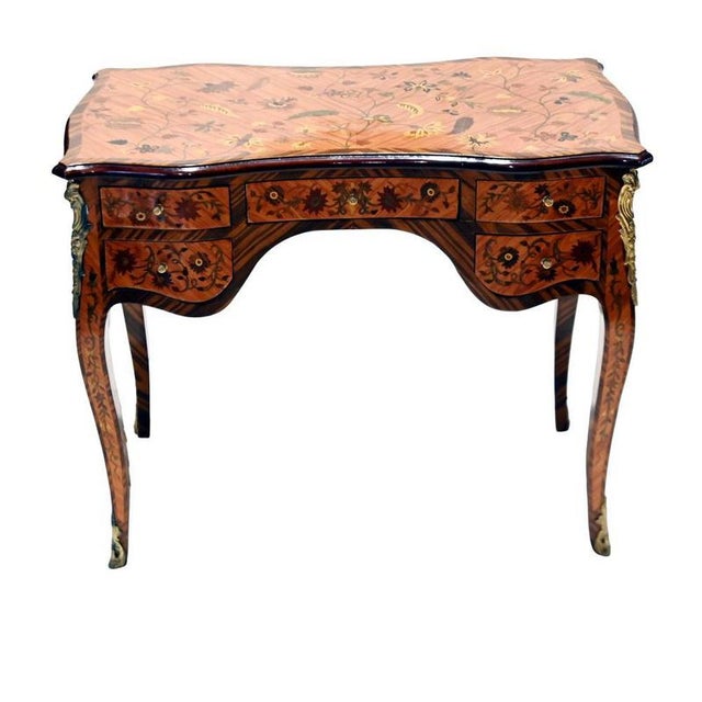 Elegant French Louis XV style writing desk with extensive floral marquetry Shaped top decorated with trailing flowers and...