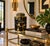 Striking hexagonal black ceramic lidded jar featuring an expressive, irregular gold pattern over a glossy black ground....