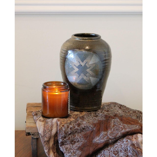 A wonderful vintage hand-thrown pottery vase, with a blue design, almost tribal in appearance. No chips, cracks or repairs...