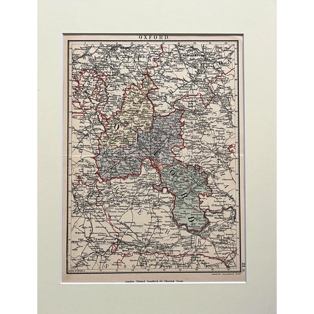 An original antique map of Oxford England by Edward Stanford circa 1890s. Published in London with hand color. Presented...
