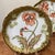 Discover the elegance and artistry of French porcelain with this exquisite pair of Elite Limoges collector plates. Adorned...