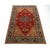 A striking antique Persian Serapi Heriz-style rug with a beautifully aged rust-red field, bold central medallion, warm...