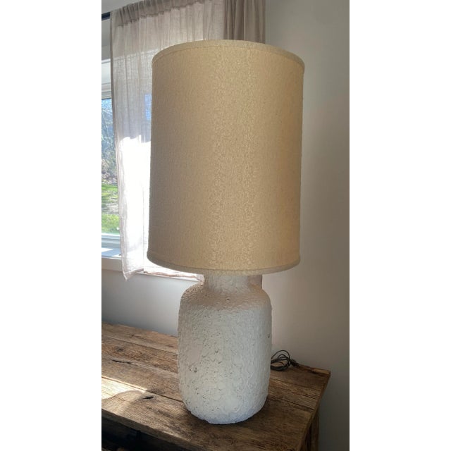 Incredible dramatic 1960's table lamp that stands 36" tall x 16.25" wide with original shade. Matte off white crater lava...