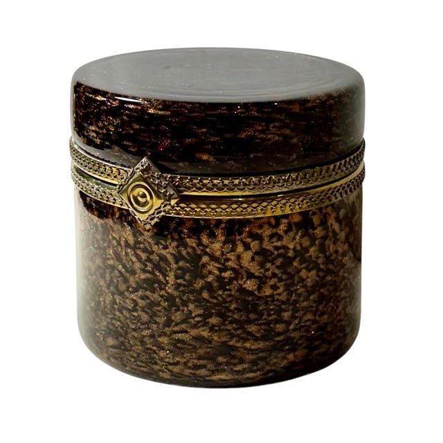 A striking Murano art glass jewelry box from the 1950s executed in the glamorous Hollywood Regency style. Rich brown hand...