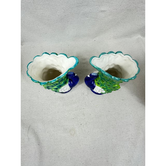 Strutting peacock vases hand painted with blue, green and white details. This is a pre-owned item so please see all...