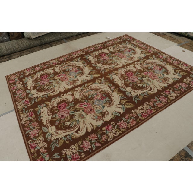 Handwoven in wool, this 7x9 flatweave rug “Acanthus” from China features floral patterns that are often seen in botanical...