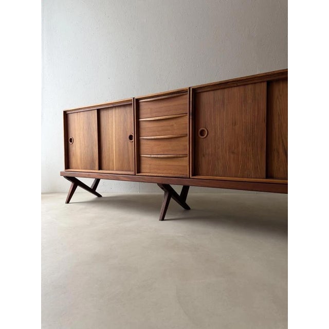 Some designs need no superfluous details to make an impression. This exceptional sideboard by Rudolf Glatzel for Fristho...