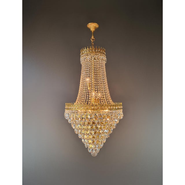 This newly crafted, unused chandelier combines the classic shape of an Empire-style basket chandelier with an unusually...