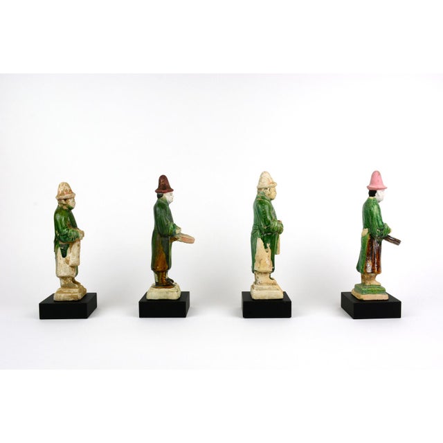 Ming musicians (men) 7.75h A set of glazed musicians with drums and trumpets. The base of the sculpture is 2 inches by...