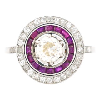 Circa 1930 Antique French Art Deco Engagement Ring, Platinum, Diamonds, and Ruby Halo For Sale
