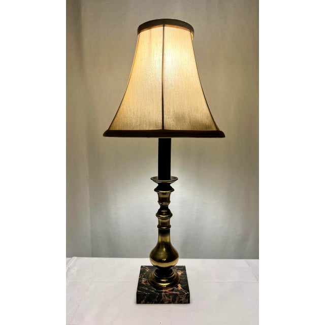 Welcome to Turtle and Crane! Let us introduce you to this Vintage Hollywood Regency Brass Candlestick Lamp on Marble Base...