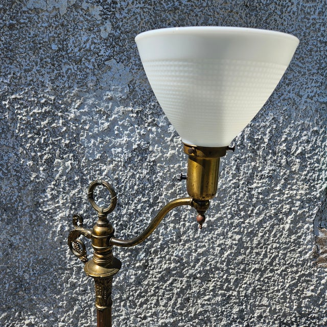 Brass Torchiere Floor Lamp With Milk Glass Shade and Green Onyx Base Scrolled leaf forms along its length and at its feet,...