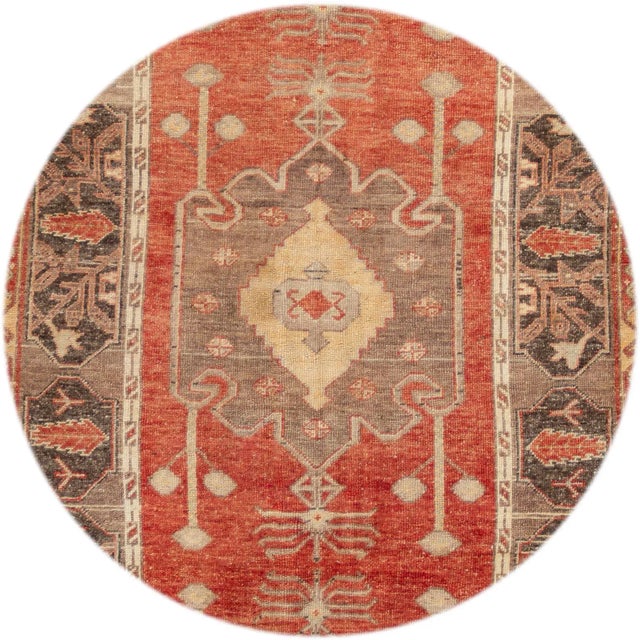 Beautiful antique Turkish Anatolian runner rug, hand-knotted wool with a red field, brown frame, and tan accents in all-...